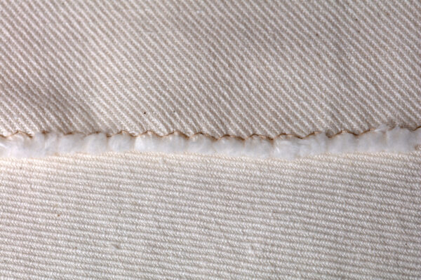 Warp and fill face of 2/2 twill USDA organic cotton and long fiber hemp canvas made in Pennsylvania.