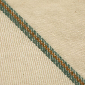 Organic Cotton and whitened hemp raw selvedge denim woven with Draper looms with Tuscarora green and brown colors.