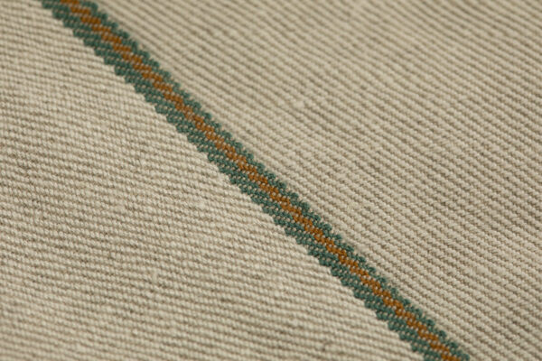All long fiber Natural tone Hemp Raw American 2/2 selvedge denim woven with Draper looms featuring Tuscarora Mills green and brown colors.