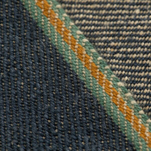All Hemp American 3/1 raw selvedge denim woven with Draper shuttle looms featuring Tuscarora Mills green and brown colors.